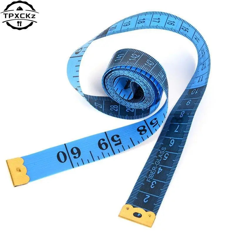 Blue flexible tape measure with black markings and a spool of measuring tape visible.