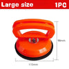 An orange heavy duty car dent puller tool with two suction cups shown against a white background.