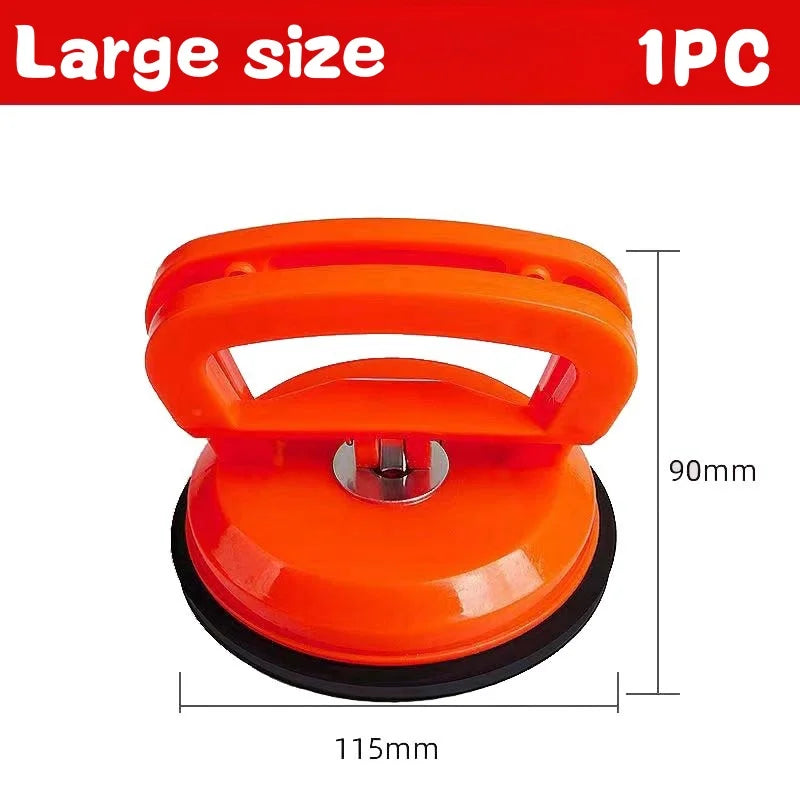 An orange heavy duty car dent puller tool with two suction cups shown against a white background.