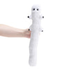 A hand is holding a white, elongated plush toy resembling a ghost or witch figure.