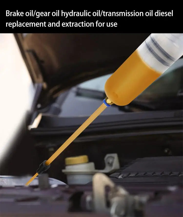 A yellow manual fluid transfer syringe pump is shown extracting or replacing brake, gear oil, hydraulic, or transmission oil 