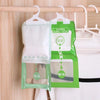 Green hanging bags containing moisture absorbers for closets and cabinets