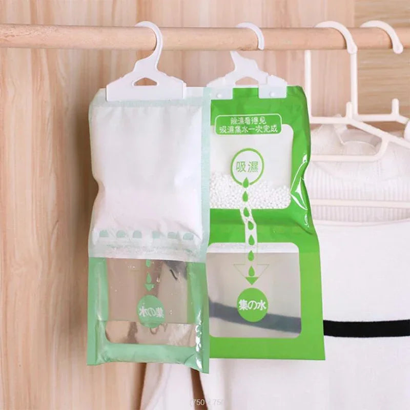 Green hanging bags containing moisture absorbers for closets and cabinets