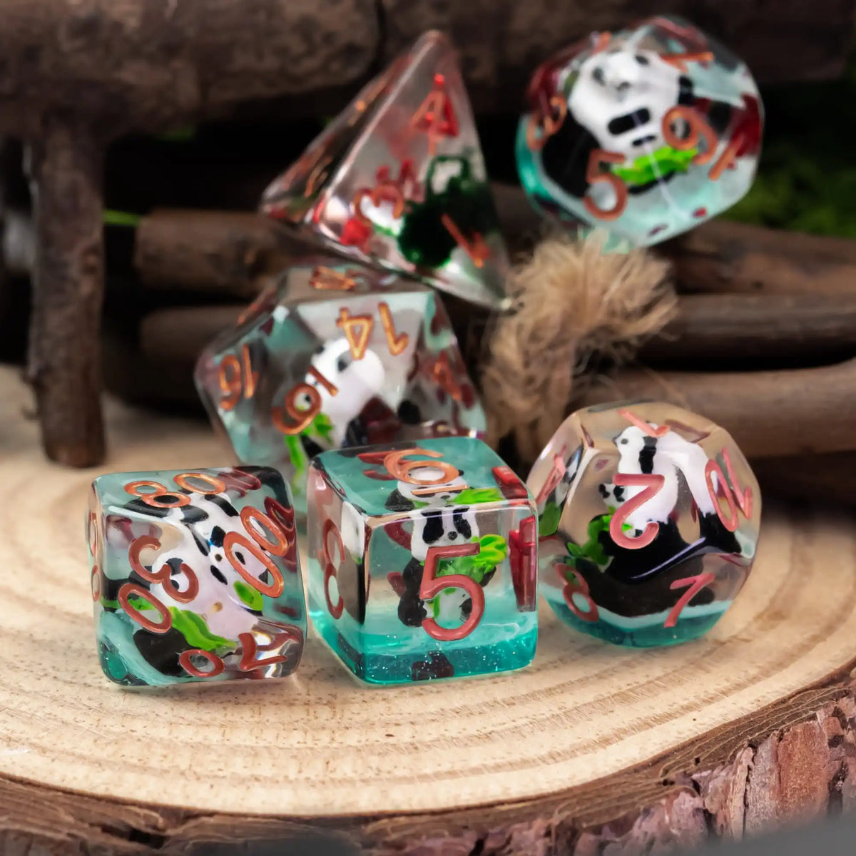 A set of colorful animal resin dice showing various numbers and designs for role-playing games