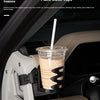 A magnetic car phone mount with a cup holder base is shown inside a car, holding a beverage cup.