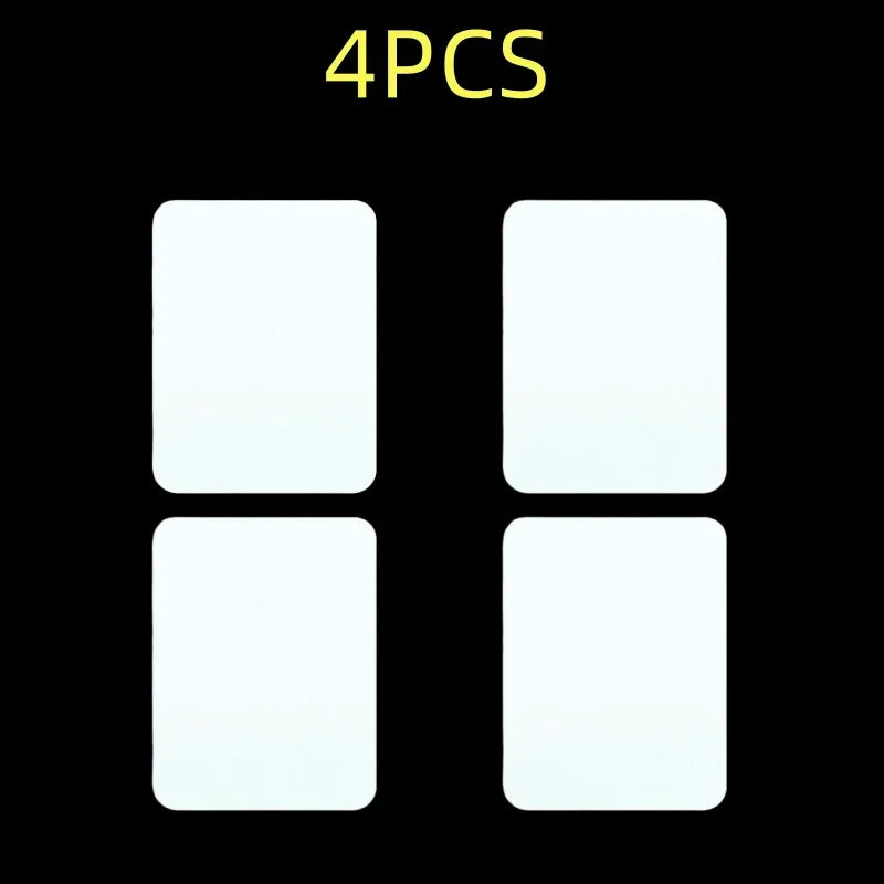 Four white iron-on fabric patches displayed against a black background.