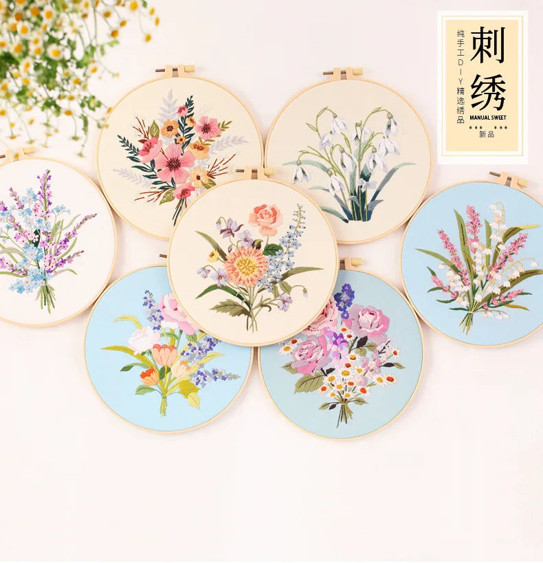 A collection of round embroidery kits featuring floral designs in various colors and styles.