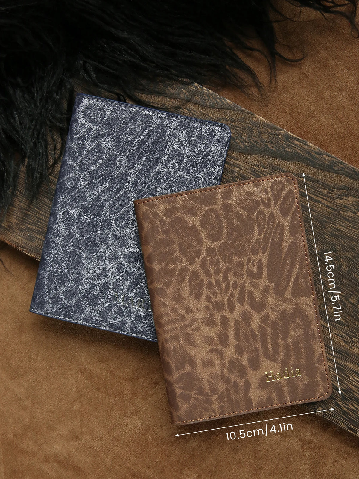 A brown leopard print passport holder with personalized name embossing resting on a wooden surface.