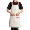 A person wearing a beige PU leather multi-pocket kitchen apron with brown straps over a black shirt.