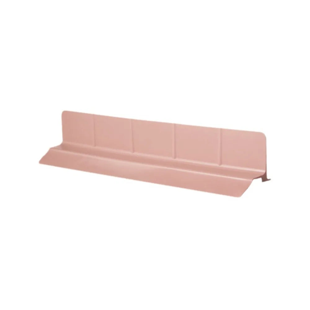 A pink flexible silicone sink splash guard with suction cups.