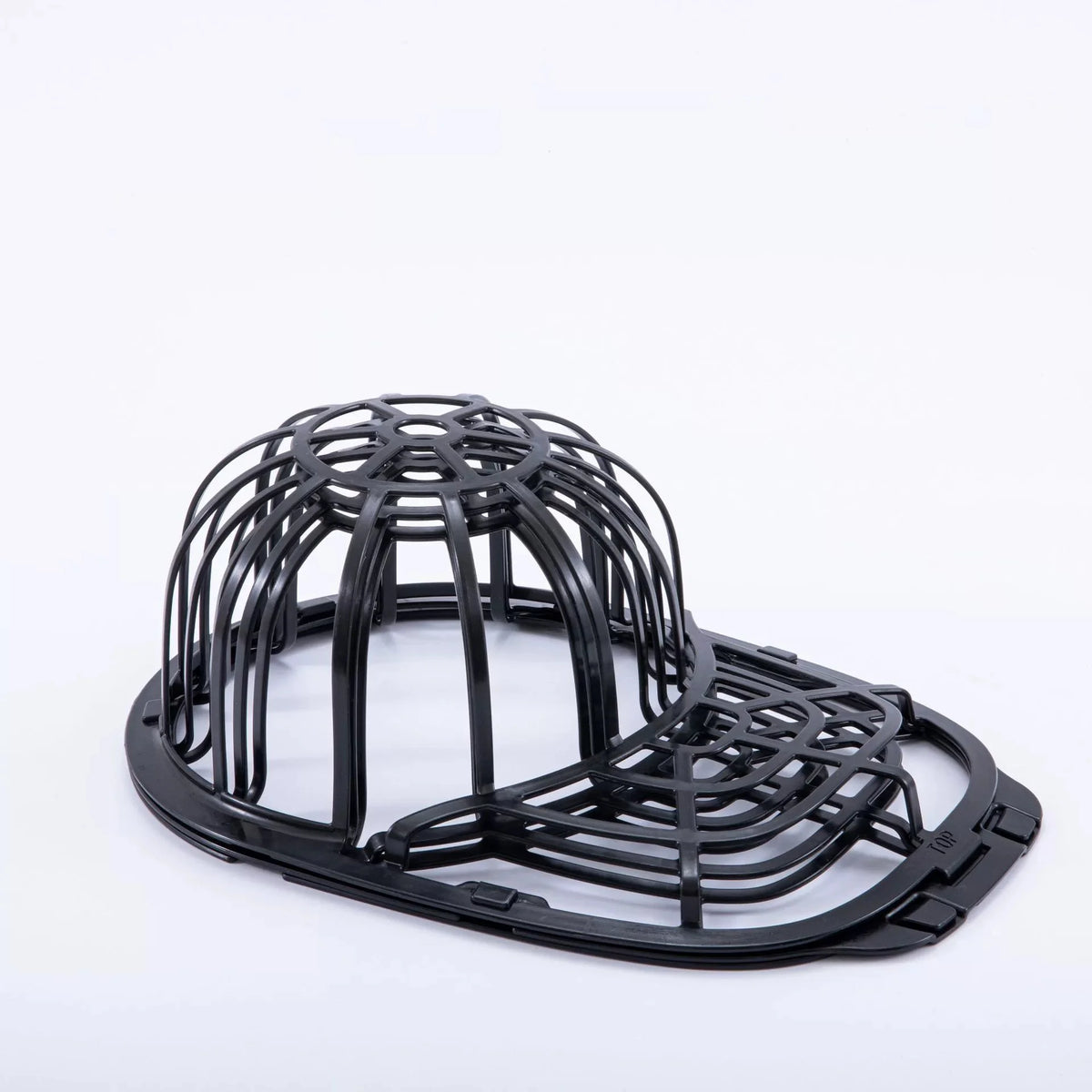 Black cap protector cage designed to prevent damage to a washing machine cap.