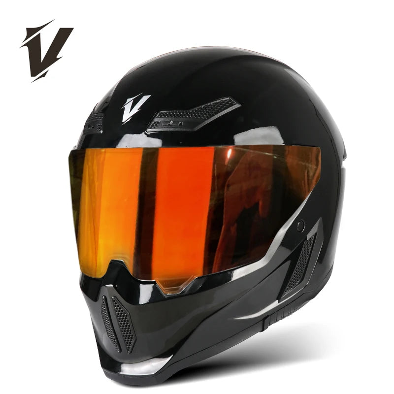 A black full-face motorcycle helmet with an orange tinted visor and ventilation details.