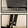 Close-up of a black crystal-embellished chain shoulder bag featuring diamond decoration and hardware hooks.