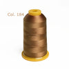 A spool of Col. 184 polyester embroidery thread in a golden brown color with a yellow core.
