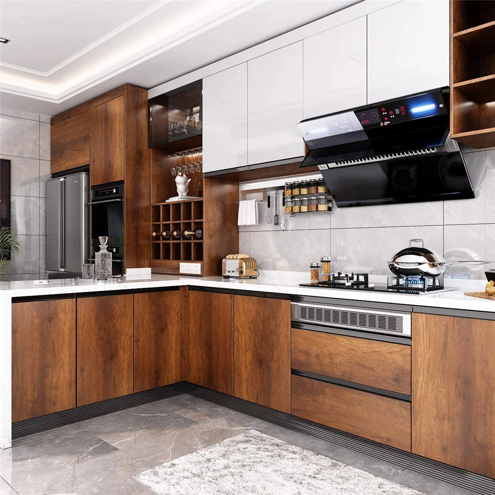 Modern kitchen featuring wood grain cabinetry, white cabinets, and a black range hood above a speckled countertop.