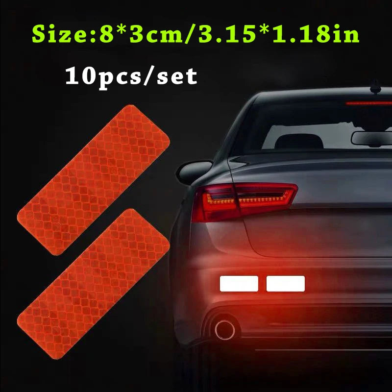Ten reflective orange safety strips for car visibility shown next to a dark car body.