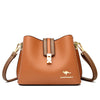 A brown leather shoulder bag with a gold-toned clasp and strap is shown against a white background.
