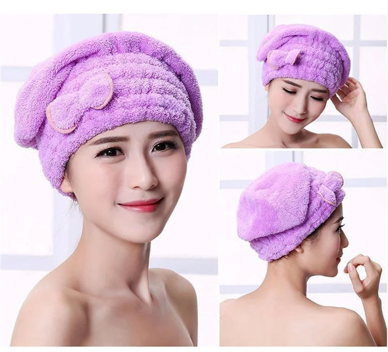 A woman models a purple microfibre quick-dry hair towel wrap with a bowknot on her head.