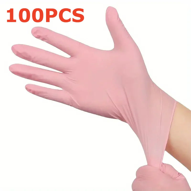 A hand wearing a pink disposable nitrile glove is shown, with the text 100PCS visible.