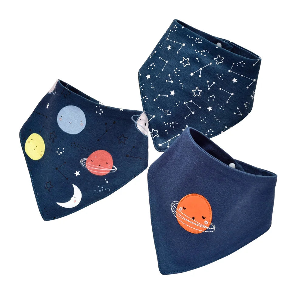 A set of three dark blue baby bibs featuring various cartoon celestial prints like stars, moons, and planets.