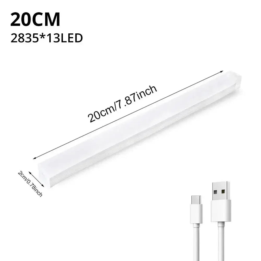 A white LED light bar with a rectangular shape and a connector on the end.