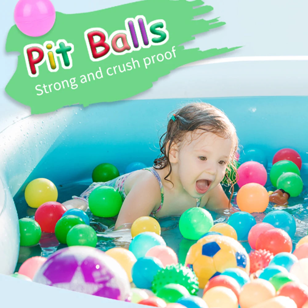 A child is playing in a blue ball pit filled with colorful plastic balls.