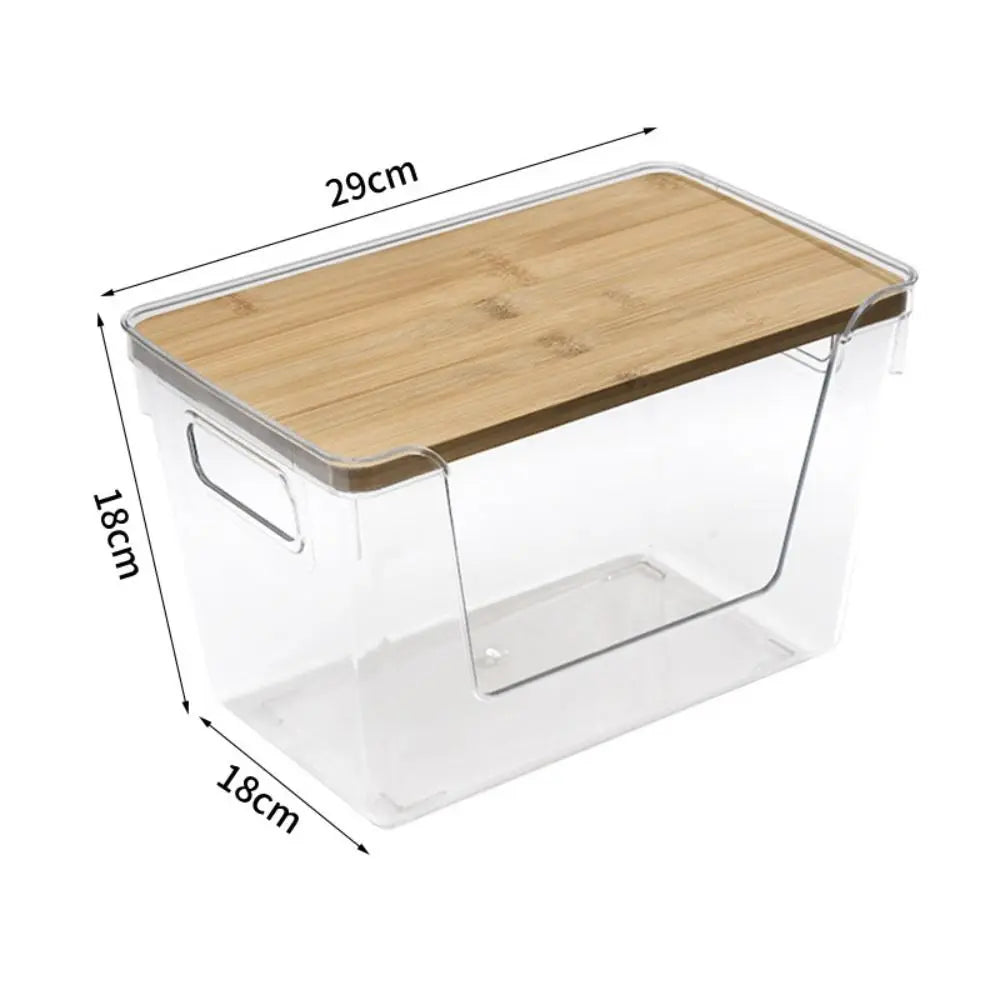 Clear plastic pantry storage bin with a bamboo lid and wooden tray, shown from above.