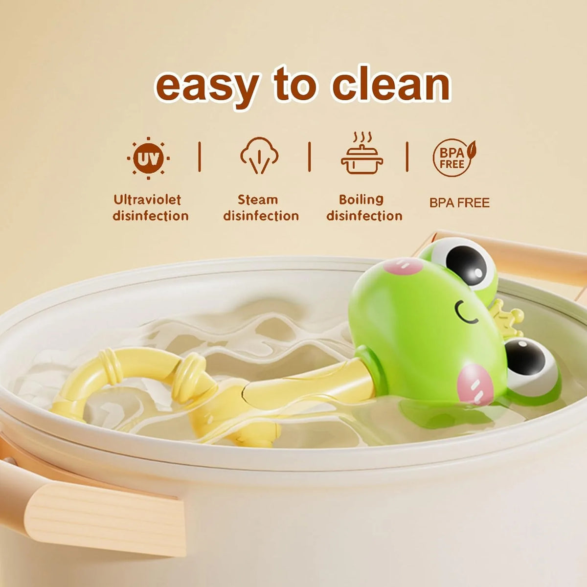 A green baby animal rattle teether toy is shown submerged in water, with icons indicating ultraviolet, steam, and BPA free di