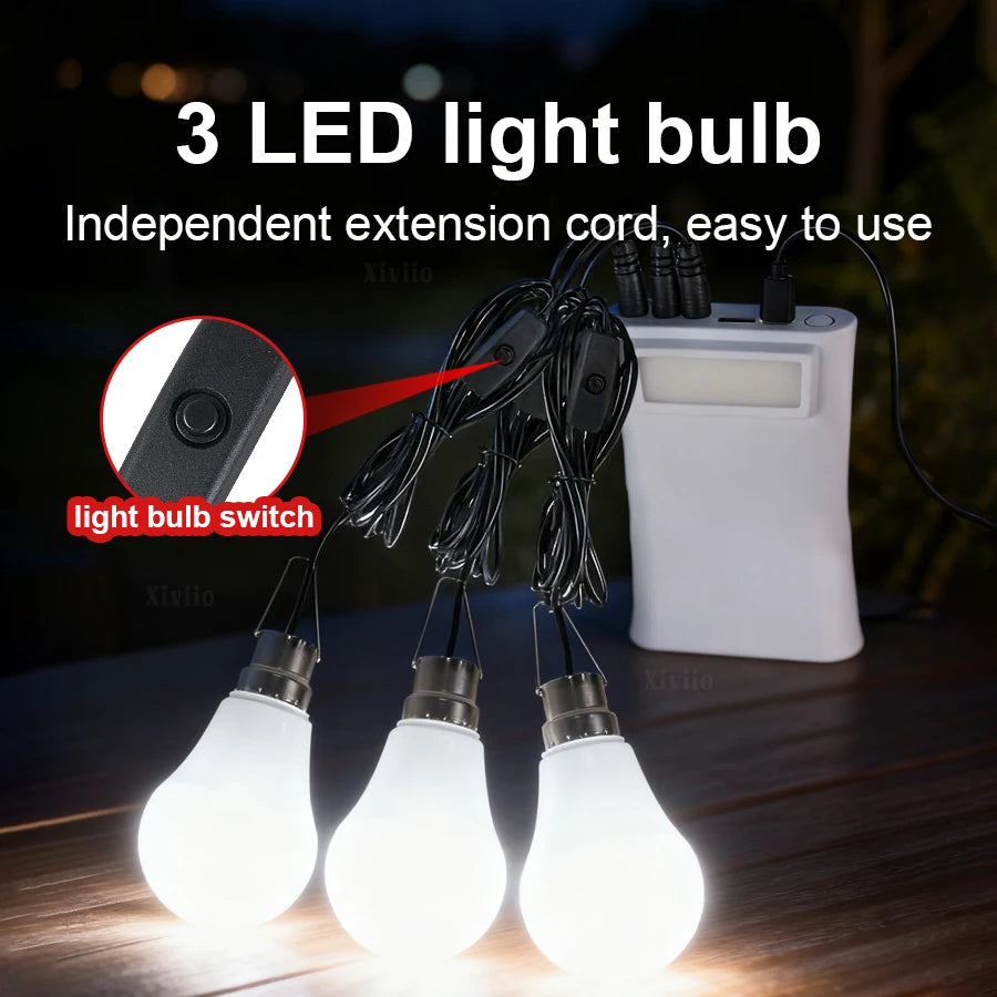 Three LED light bulbs hanging from an extension cord and a white power bank.