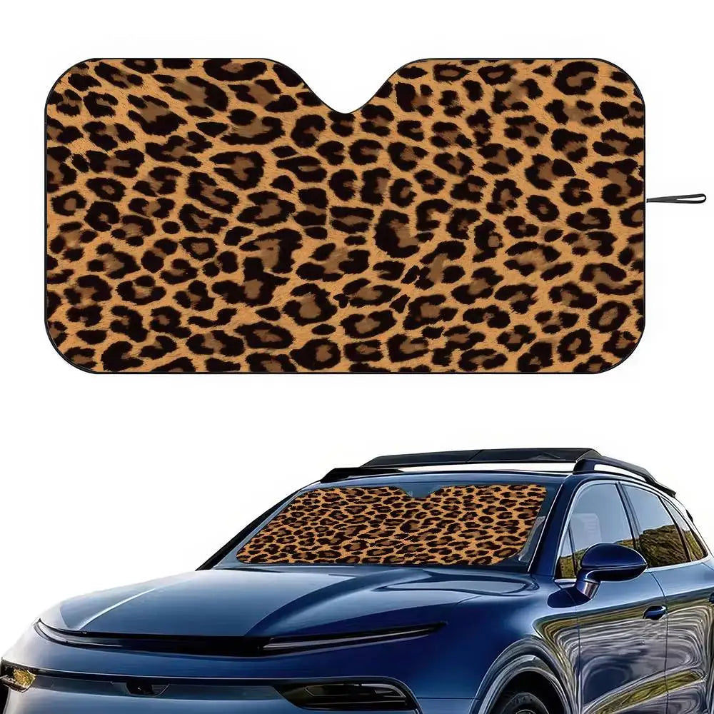 Leopard print car windshield sunshade applied to a blue car.