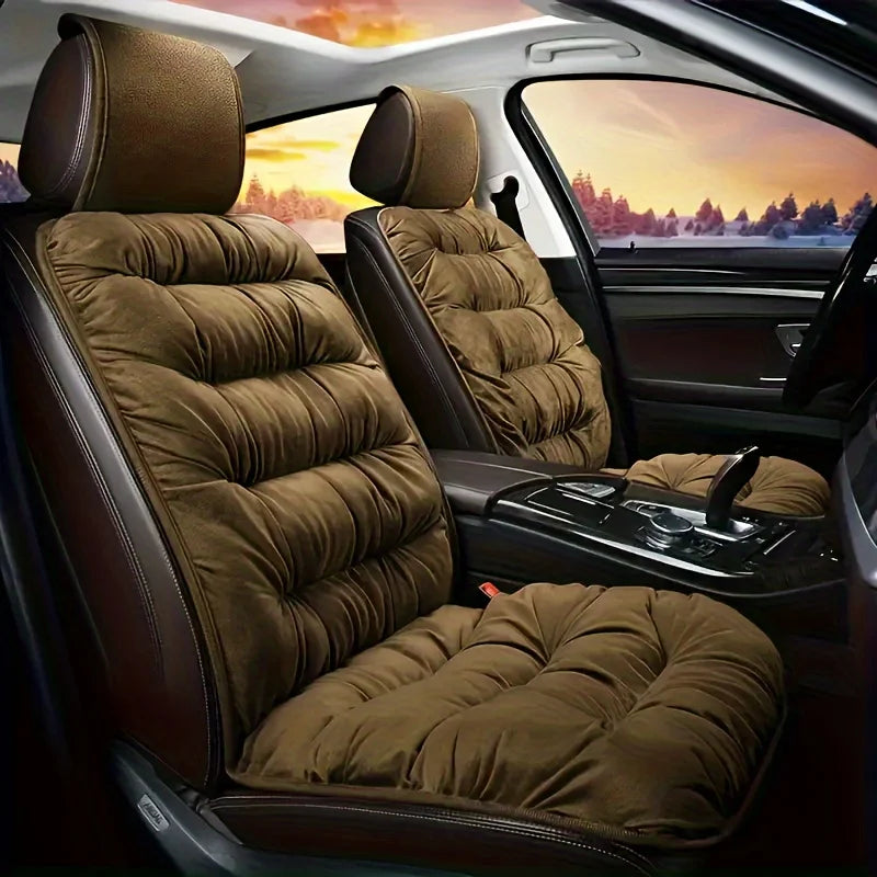 A plush brown car seat cover with a padded backrest shown inside a vehicle cabin.