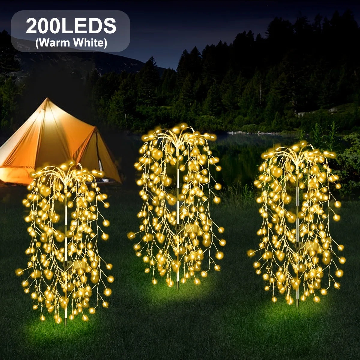 Three strands of warm white LED willow lights illuminate a grassy outdoor scene near a tent.