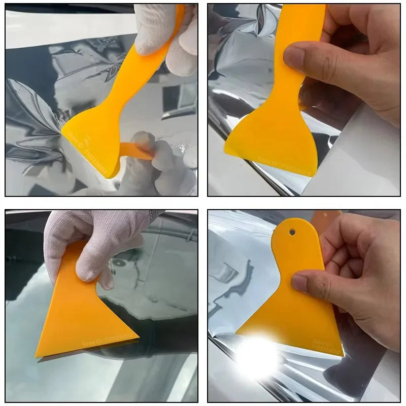 Una mano está instalando una película de vinilo amarillo en la ventana de un coche.