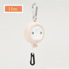 Pink retractable clothesline with a hook for portable drying.