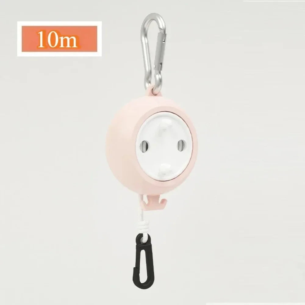Pink retractable clothesline with a hook for portable drying.