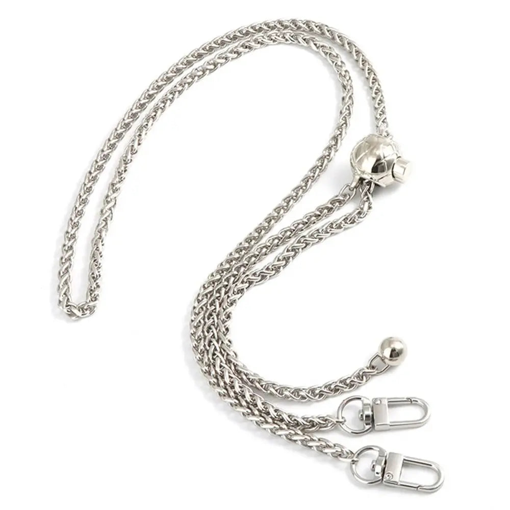 A silver metal chain strap for handbags and purses, shown in a looped form.