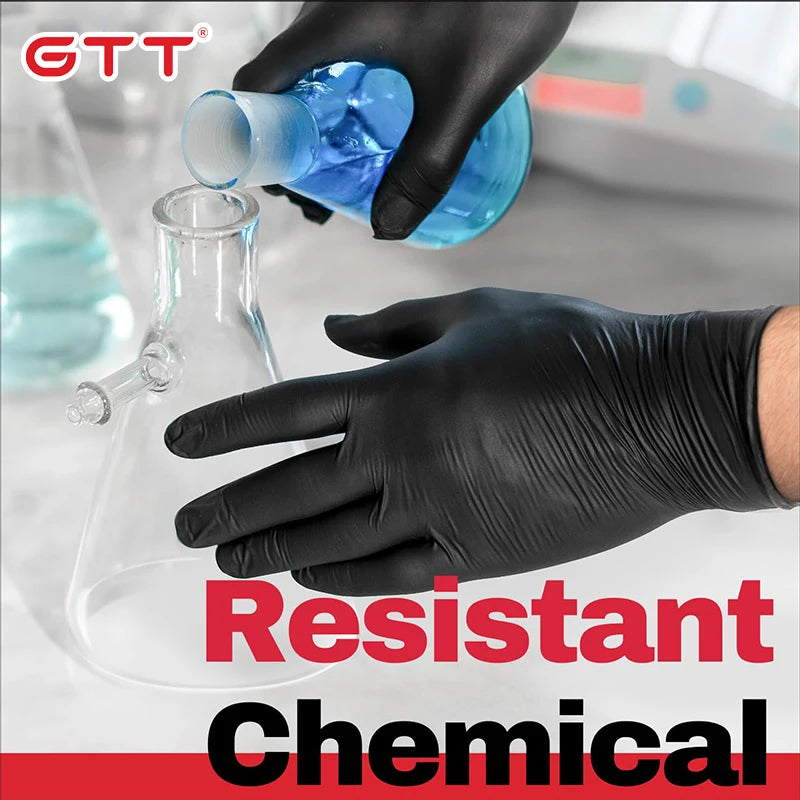 A hand wearing a black nitrile disposable glove is pouring blue liquid from a glass into a bottle.