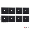 Eight square black non-stick gas stove protector mats with white circular holes.