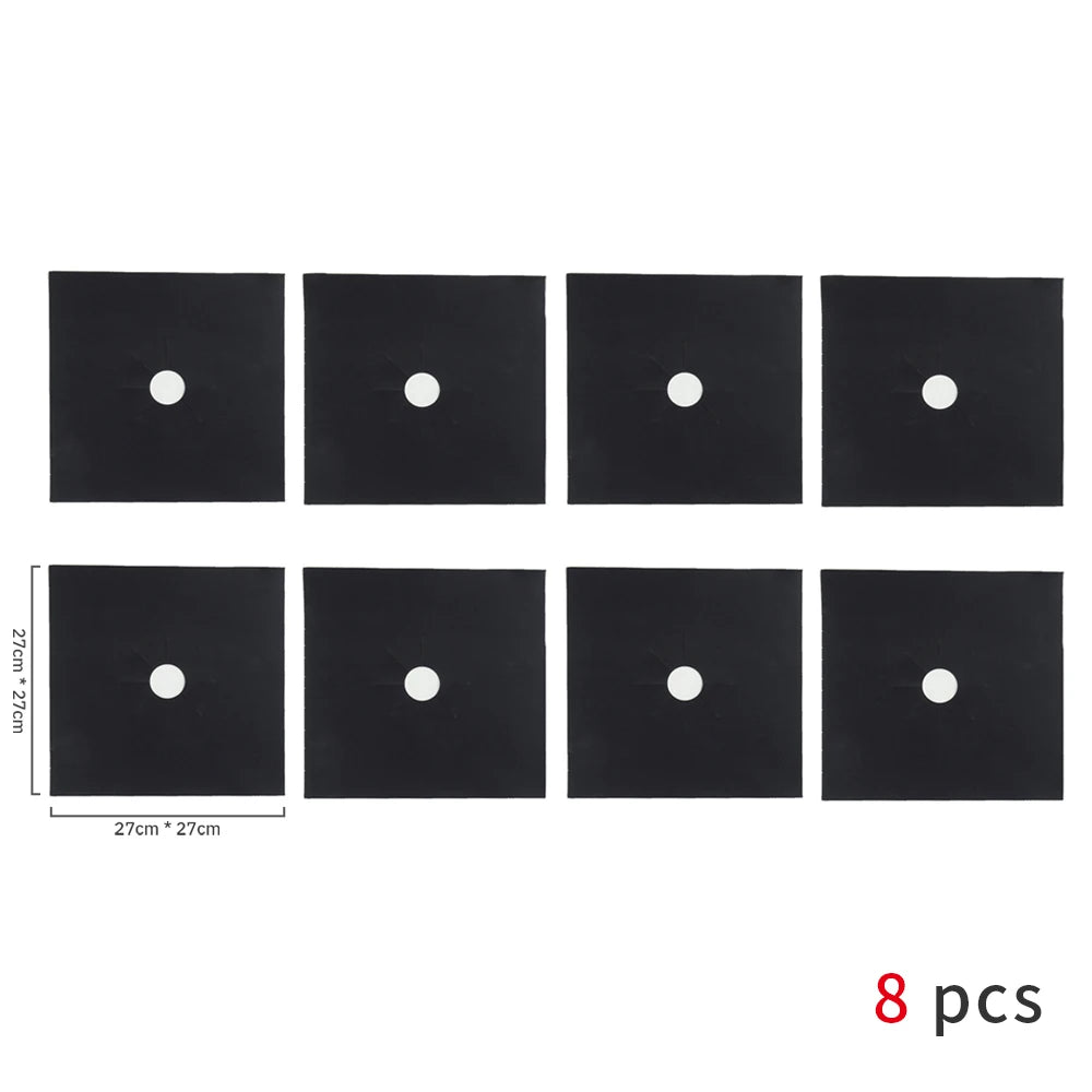 Eight square black non-stick gas stove protector mats with white circular holes.