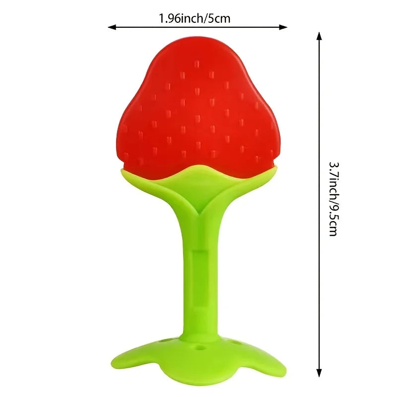 A bright red silicone strawberry baby teether with a lime green base.