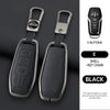 A black key case with a metal chain attached, showing the before and after effect.