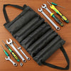 A black roll-up multi-pocket tool organizer bag filled with various hand tools and screwdrivers.