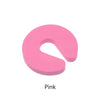A pink foam door stopper with a finger pinch protection design.