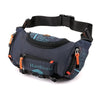 A dark blue tactical chest bag with an orange accent strap and a black adjustable strap.