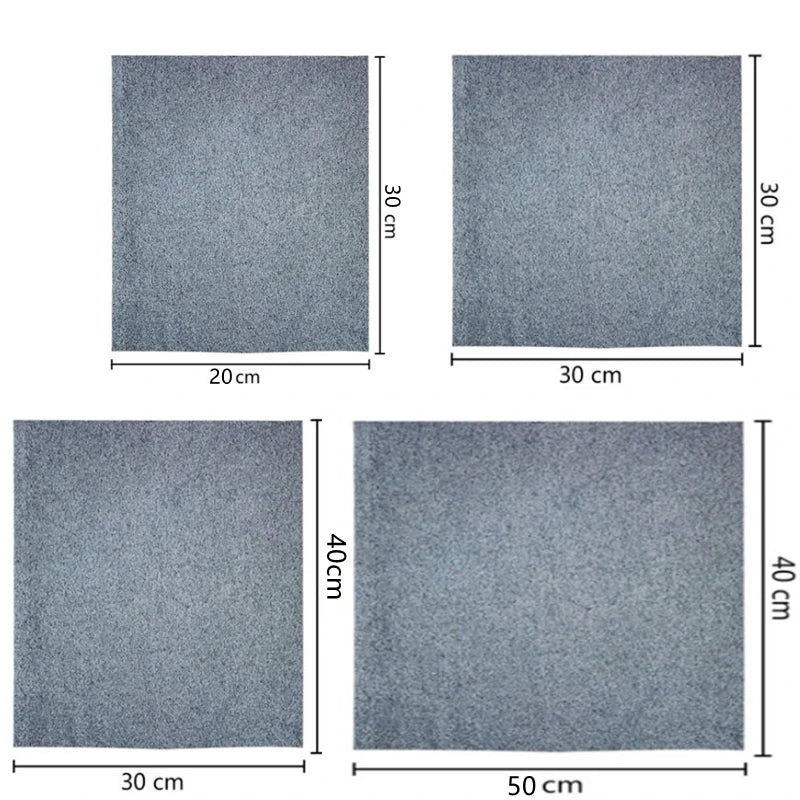 Four square cleaning cloths in varying sizes and thicknesses, showing a gray microfiber texture.
