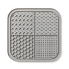 A gray silicone lick mat for dogs and cats with suction cups, featuring textured patterns.
