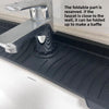A close-up of a chrome faucet and silicone splash mat designed to catch water, with text explaining how the faucet can be fol