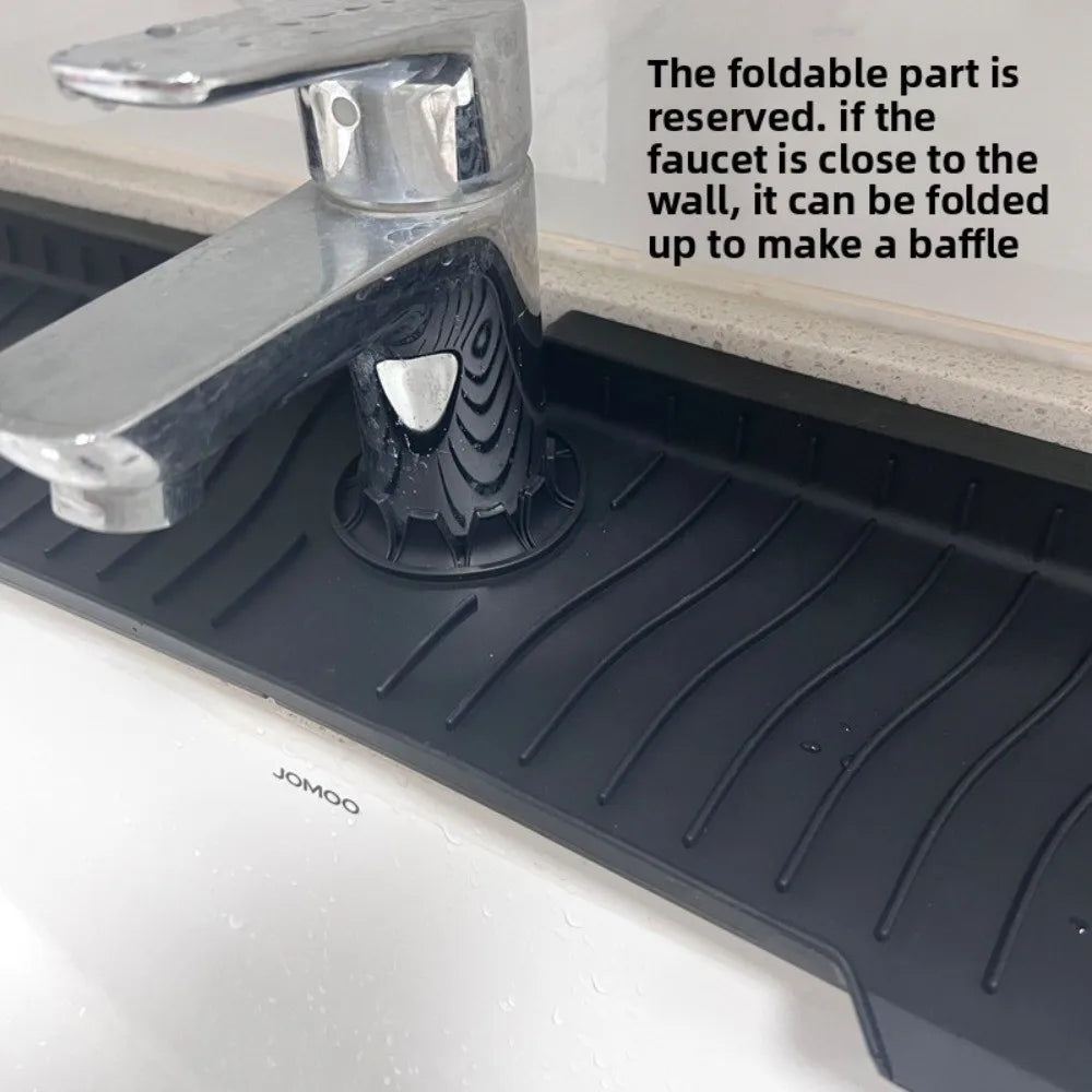 A close-up of a chrome faucet and silicone splash mat designed to catch water, with text explaining how the faucet can be fol