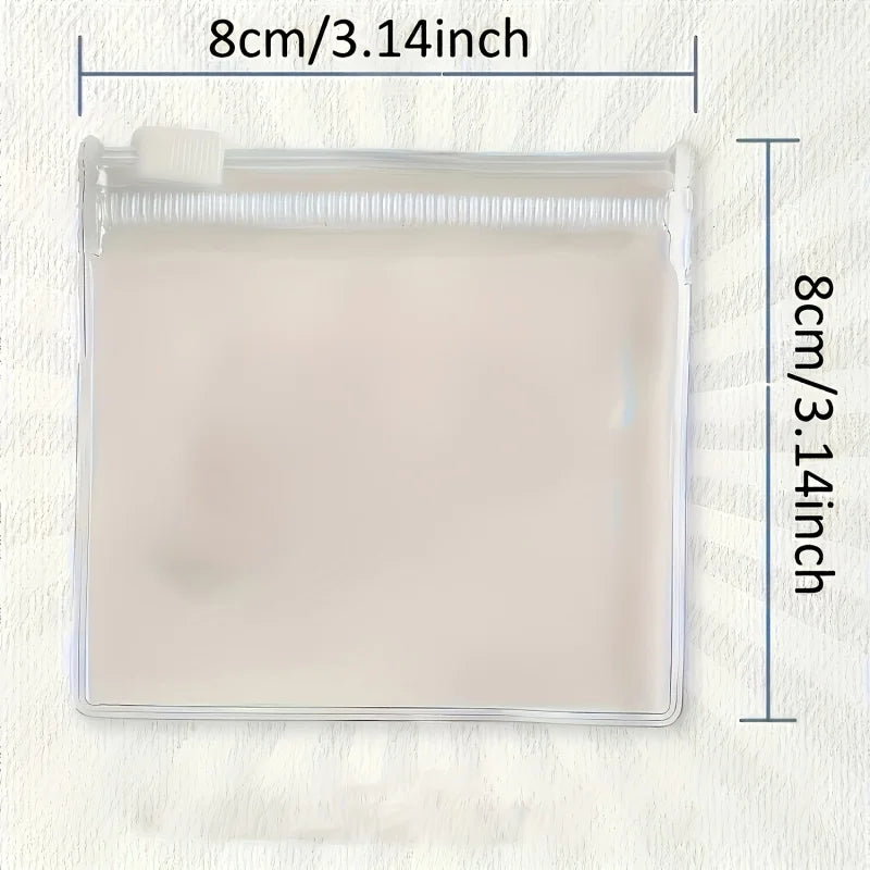 A clear plastic organizer bag with a lid and a rectangular compartment for travel medicine or toiletries.