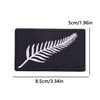 Black embroidered iron-on patch featuring a white feather design.